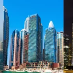 Comparison of skyline views representing Mainland, Free Zone, and Offshore company setup options with modern skyscrapers in Dubai and global financial hubs – day and night cityscapes.
